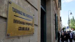 Rum Meclisi, “Göçmenlerin” TMK’ya başvurmaması için kurmayı hedeflediği fonu Bakan ile ele aldı